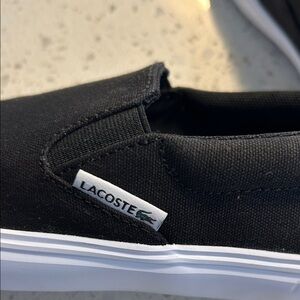Lacoste Classic Black Canvas Slip-Ons